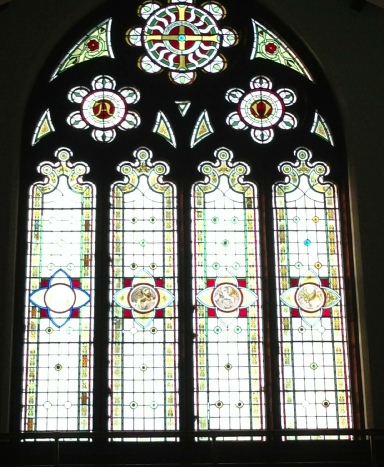 The Gospel window (showing the medallions of Matthew, Mark, Luke and John) of Whitehall Road Methodist Church in Bensham, Gateshead.
